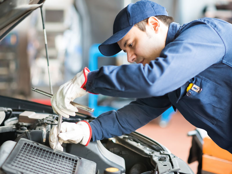 A man repairing the car