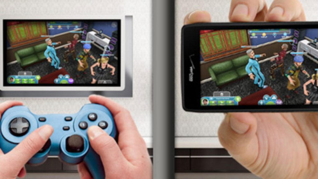 A hand holding a video game